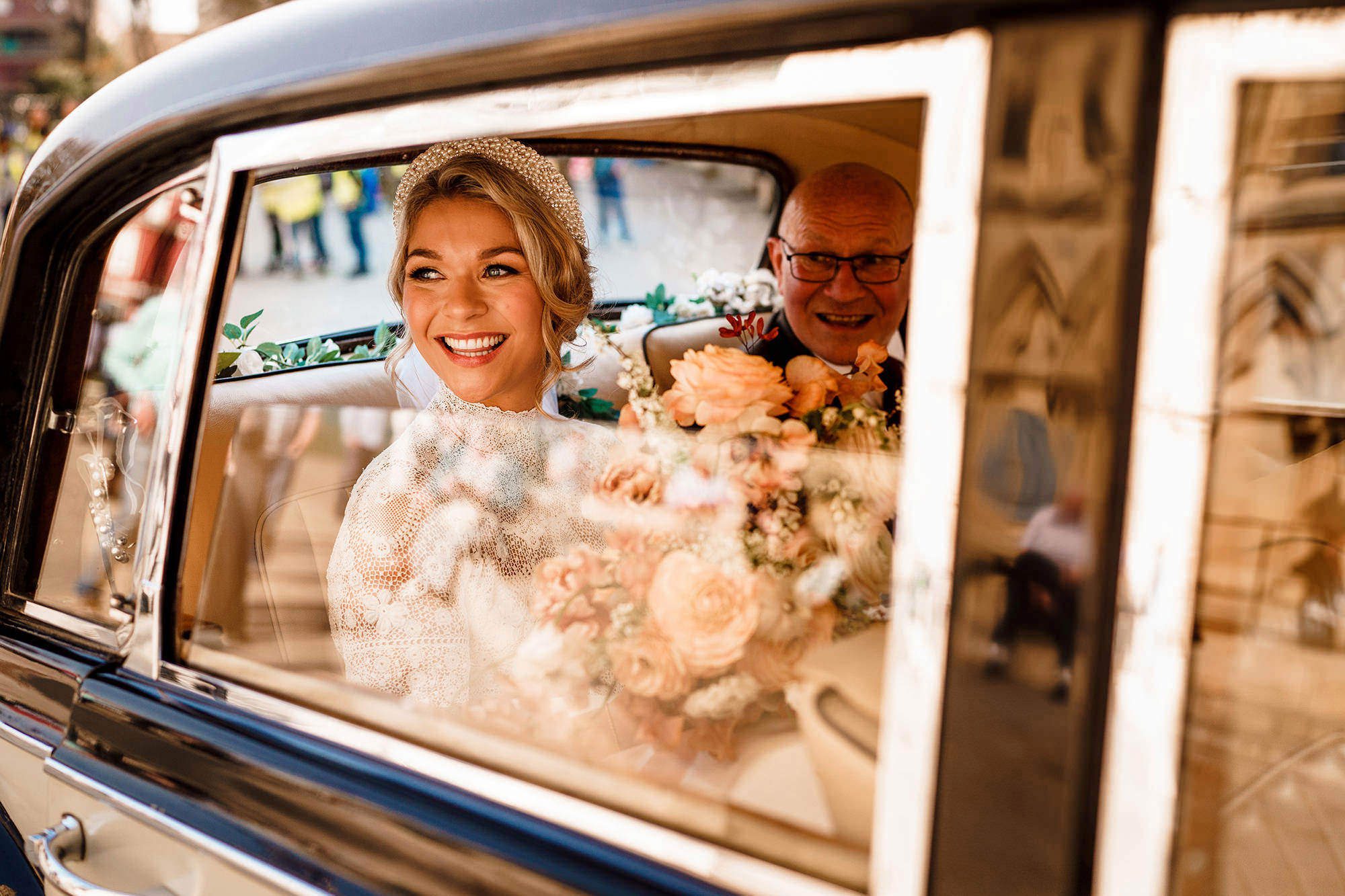 Bride in her wedding car in the Cotswolds