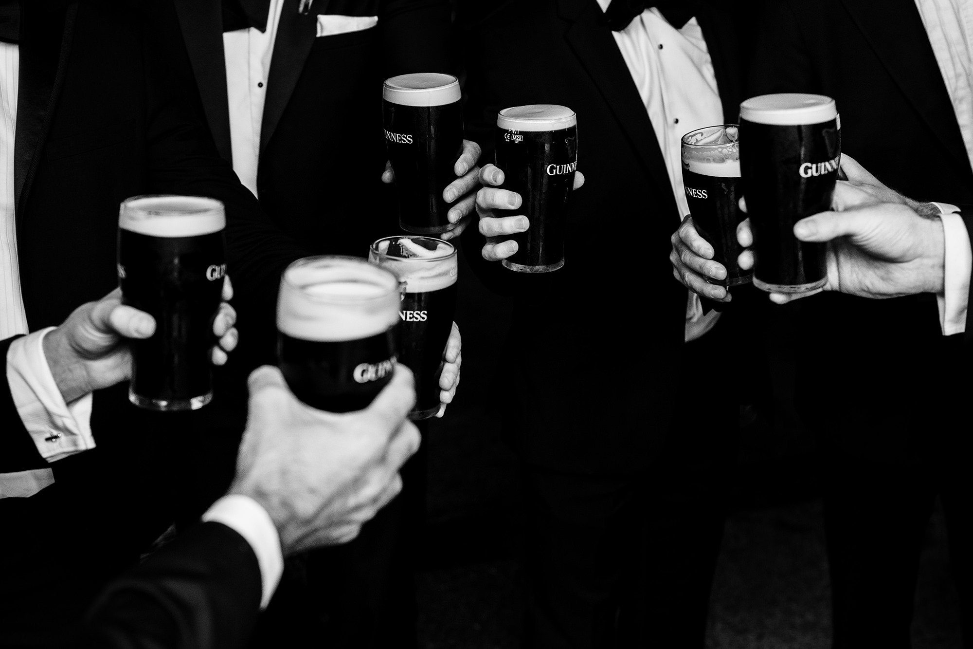 groomsmen share a drink before heading for the Cotswolds